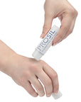 Woman applying Pro-Sil scar treatment on her hand