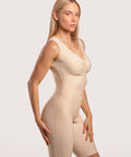 Angled view of the BB09-NS full body suit, highlighting the breathable, flat-seamed fabric and integrated bust support for post-augmentation recovery.