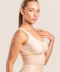 Isavela BR02 Stage 1 surgical bra featuring an integrated 2-inch elastic bust-line for stable breast augmentation and lift recovery, seamless beige medical fabric.