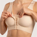 Isavela BR02 Stage 1 surgical bra featuring an integrated 2-inch elastic bust-line for stable breast augmentation and lift recovery, seamless beige medical fabric.