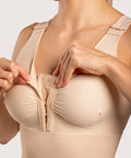 Isavela BR02 Stage 1 surgical bra featuring an integrated 2-inch elastic bust-line for stable breast augmentation and lift recovery, seamless beige medical fabric.
