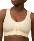 Isavela BR02 Stage 1 surgical bra featuring an integrated 2-inch elastic bust-line for stable breast augmentation and lift recovery, seamless beige medical fabric.