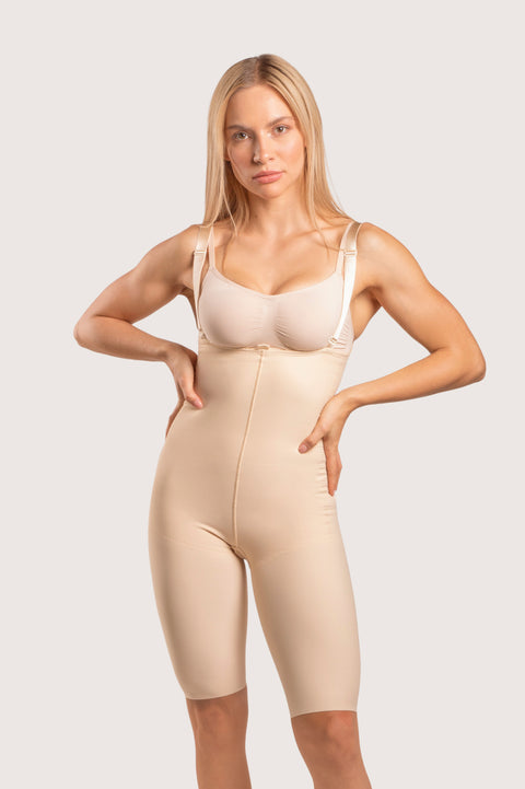 Isavela BS04 Stage 2 mid-thigh bodysuit with adjustable suspenders and zipper-free design for BBL and thigh liposuction recovery, seamless beige medical-grade fabric.